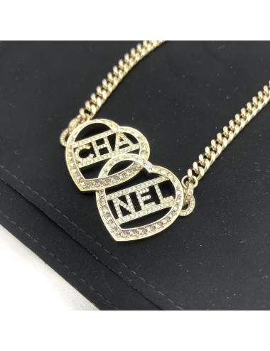 Chanel  Collier ras de cou en forme de cœur doré avec logo